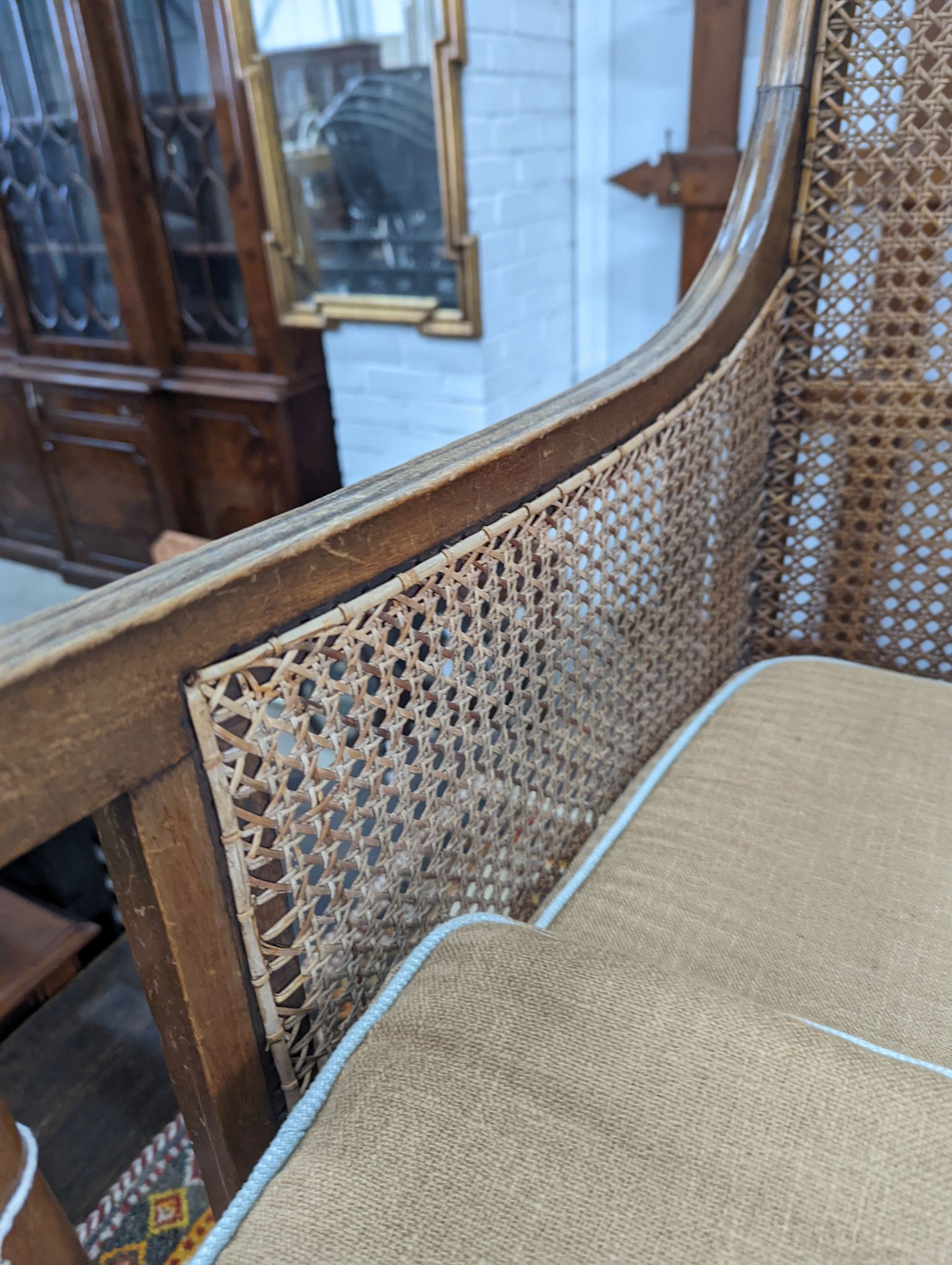 A Regency style mahogany bergere armchair, width 59cm, depth 56cm, height 97cm